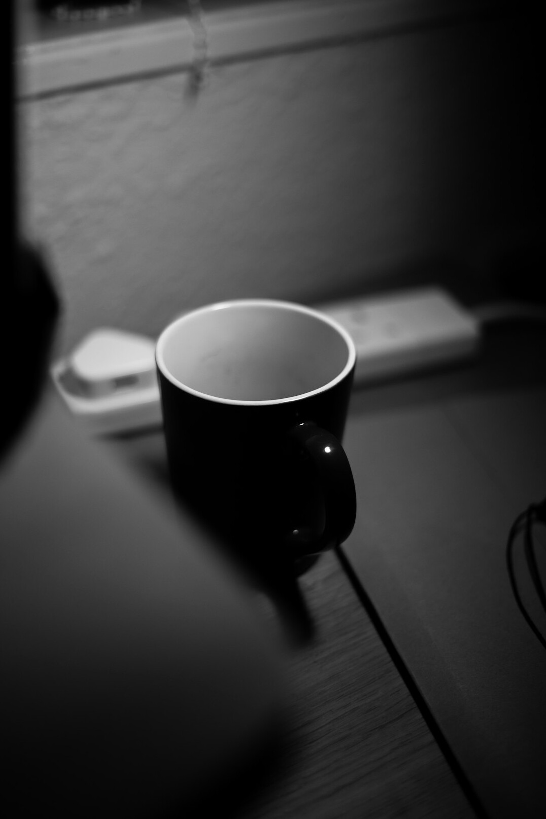 Laptop on a desk with a coffee cup