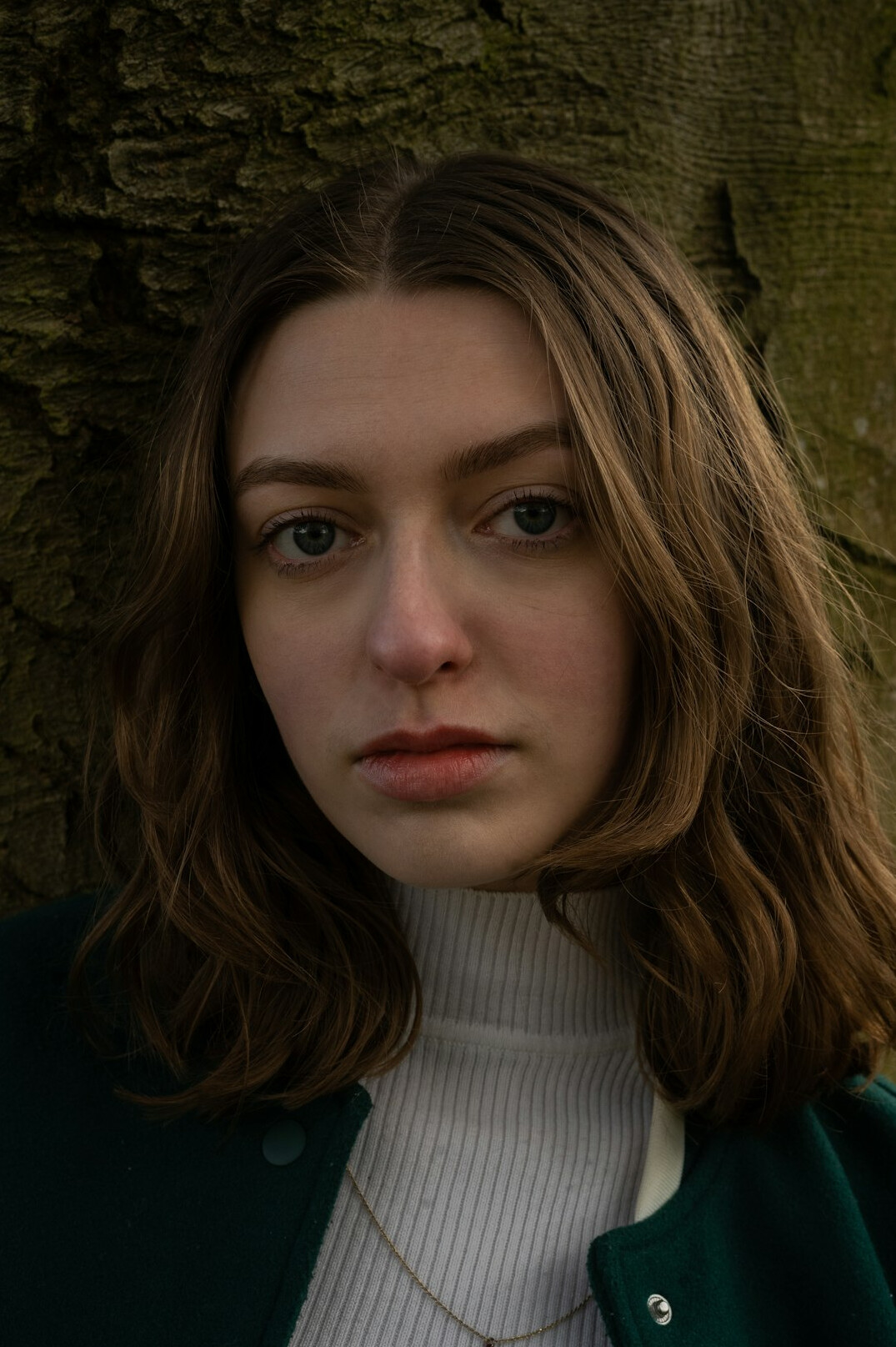 Portrait of a young woman with light brown hair