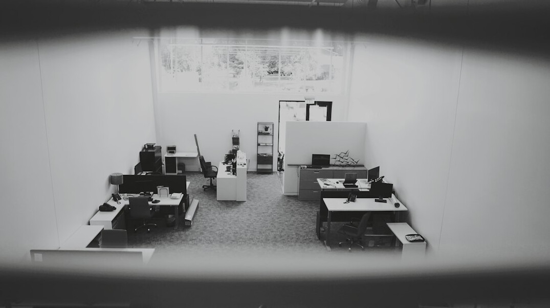 store detective watching surveillance