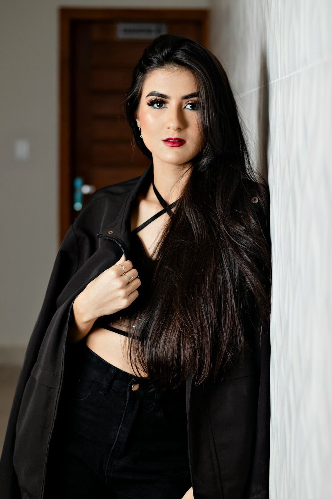 Portrait of a smiling latin woman in a blazer